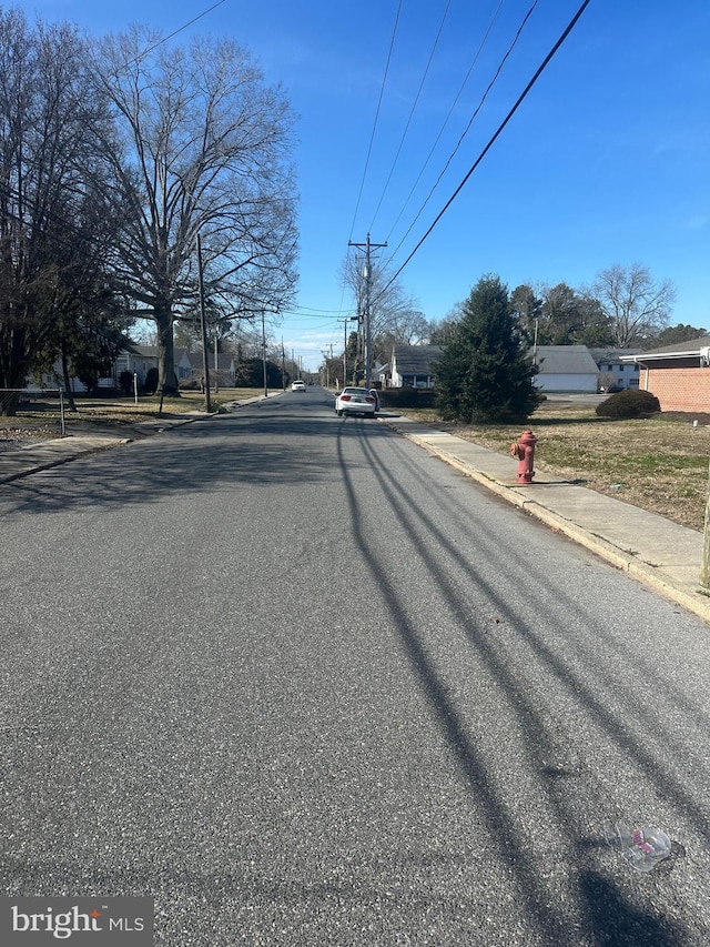 view of road featuring curbs and sidewalks