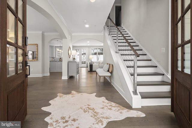 entryway featuring dark hardwood / wood-style flooring and crown molding