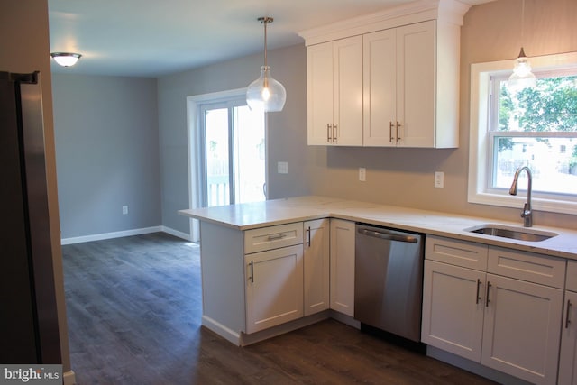 kitchen with dishwasher, white cabinetry, sink, hanging light fixtures, and kitchen peninsula