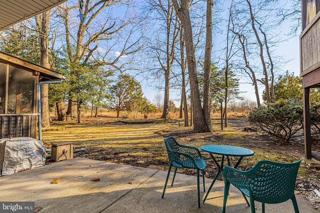 view of patio featuring a sunroom