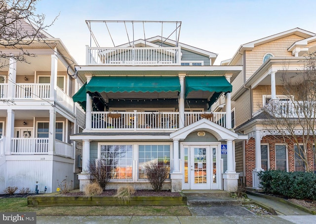 view of front of property with a balcony