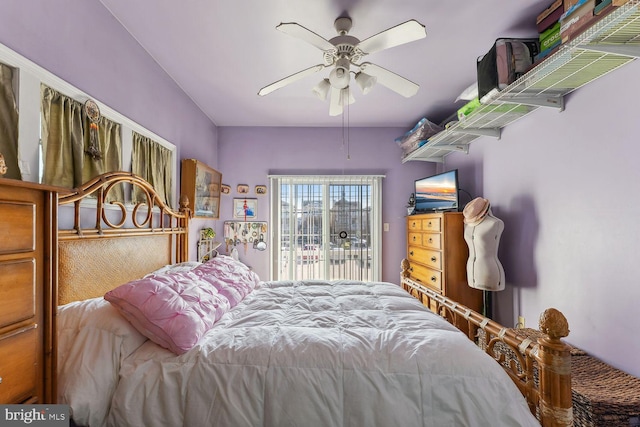 bedroom with ceiling fan and access to exterior