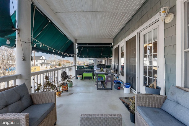 view of patio / terrace with a balcony