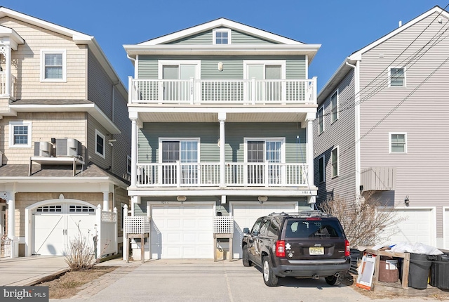 view of front of house with a balcony and central AC