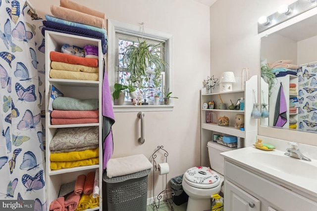 bathroom with vanity and toilet