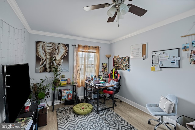 home office with ornamental molding, light wood-style floors, baseboards, and a ceiling fan