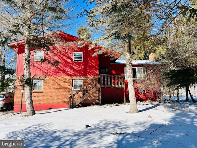 view of snow covered house