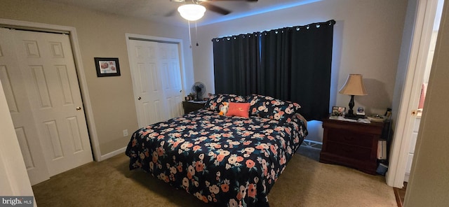 carpeted bedroom featuring ceiling fan and a closet