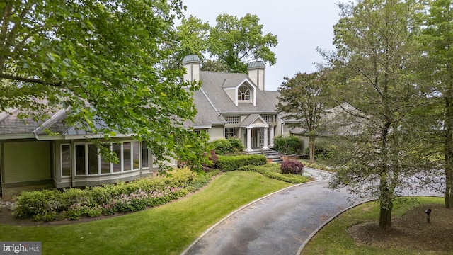 26372 Westerly Rd, Easton, MD 21601 - view of front of home with a chimney, a front yard, and asphalt driveway