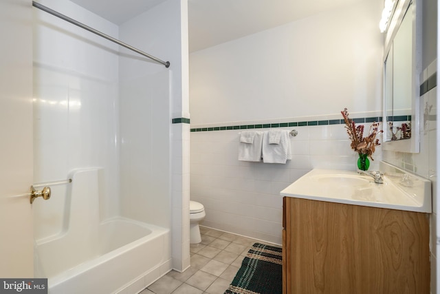 26372 Westerly Rd, Easton, MD 21601 - bathroom featuring vanity, toilet, tile patterned flooring, bathing tub / shower combination, and wainscoting