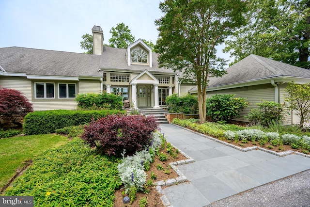 26372 Westerly Rd, Easton, MD 21601 - view of front of property with a chimney and roof with shingles