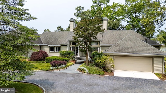 26372 Westerly Rd, Easton, MD 21601 - view of front facade with a chimney, an attached garage, concrete driveway, and roof with shingles
