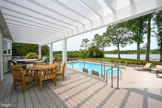 26372 Westerly Rd, Easton, MD 21601 - outdoor pool with a pergola, a deck with water view, outdoor dining area, and view of scattered trees