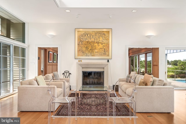 26372 Westerly Rd, Easton, MD 21601 - living area featuring a glass covered fireplace, wood finished floors, and recessed lighting