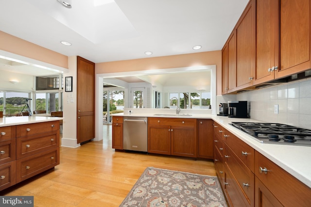 26372 Westerly Rd, Easton, MD 21601 - kitchen with stainless steel appliances, brown cabinets, light wood-type flooring, plenty of natural light, and recessed lighting