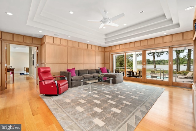 26372 Westerly Rd, Easton, MD 21601 - living area featuring a raised ceiling, a decorative wall, light wood finished floors, ceiling fan, and recessed lighting
