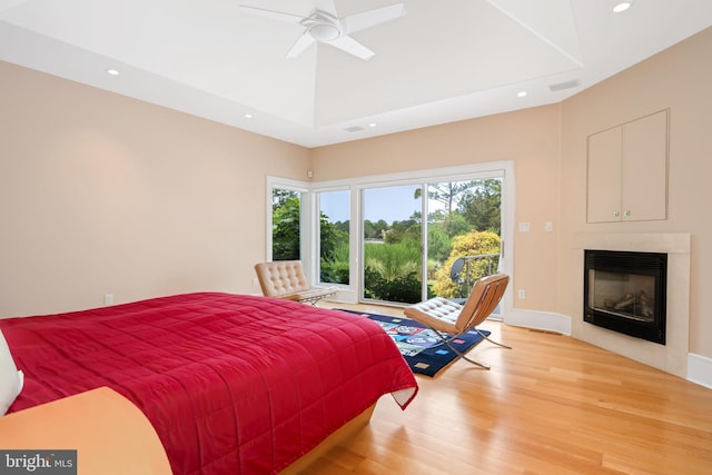 26372 Westerly Rd, Easton, MD 21601 - bedroom with wood finished floors, a glass covered fireplace, recessed lighting, ceiling fan, and access to outside