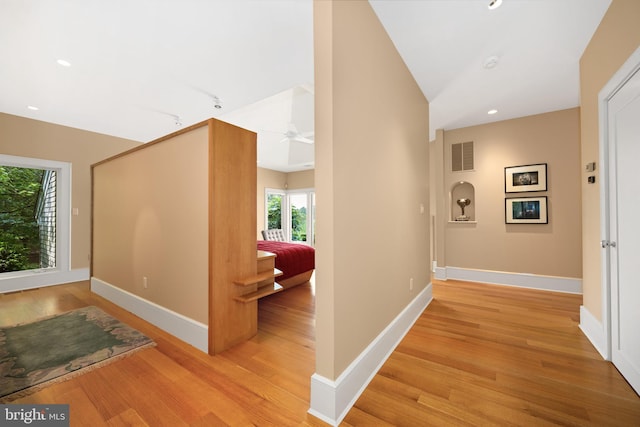 26372 Westerly Rd, Easton, MD 21601 - corridor featuring light wood-type flooring, baseboards, vaulted ceiling, and recessed lighting