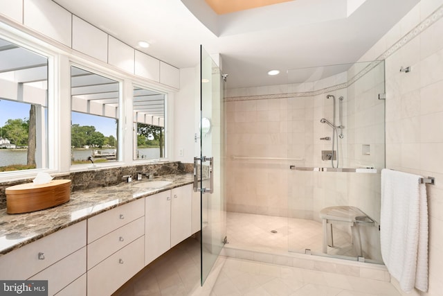 26372 Westerly Rd, Easton, MD 21601 - bathroom with a shower stall, vanity, tile patterned flooring, and recessed lighting