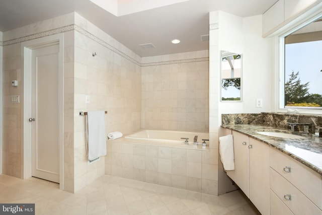 26372 Westerly Rd, Easton, MD 21601 - full bath featuring a garden tub, tile patterned floors, vanity, tile walls, and recessed lighting