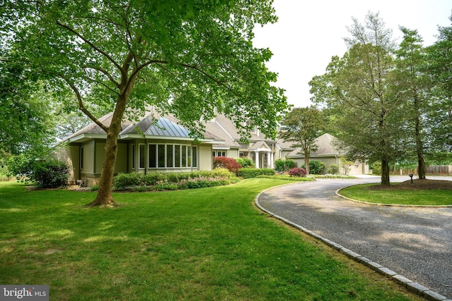 26372 Westerly Rd, Easton, MD 21601 - view of front of home with gravel driveway, a front lawn, and a standing seam roof