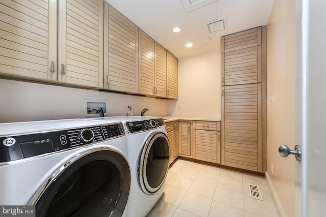 26372 Westerly Rd, Easton, MD 21601 - laundry area featuring cabinet space, washer and clothes dryer, light tile patterned flooring, recessed lighting, and baseboards