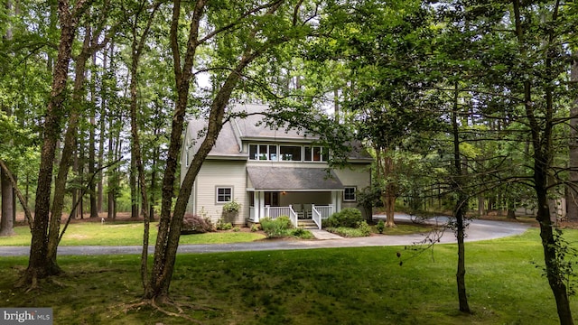 26372 Westerly Rd, Easton, MD 21601 - view of front facade with a porch, a front lawn, and a shingled roof