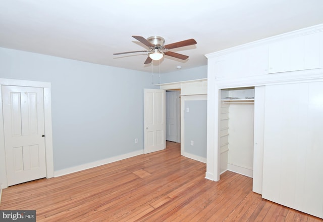 unfurnished bedroom featuring ceiling fan and light wood-type flooring