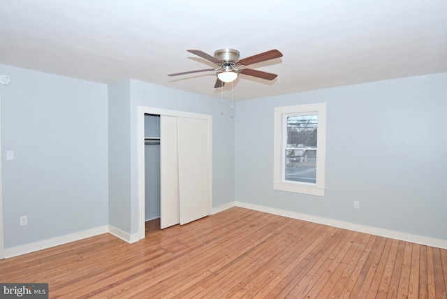 unfurnished bedroom featuring a closet, ceiling fan, and light hardwood / wood-style flooring