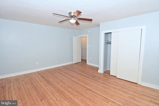 unfurnished bedroom with a closet, ceiling fan, and light wood-type flooring