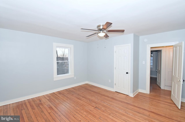 unfurnished bedroom with light hardwood / wood-style flooring and ceiling fan