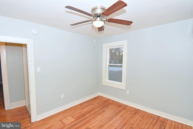 unfurnished room featuring ceiling fan and light wood-type flooring