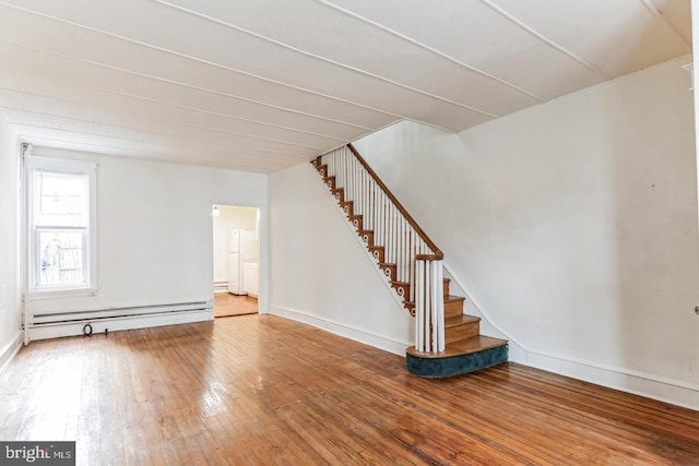 interior space with baseboard heating and wood-type flooring