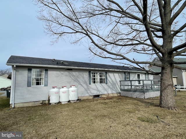 exterior space featuring a yard and a deck