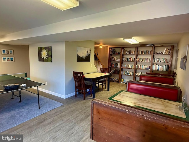 recreation room with wood-type flooring