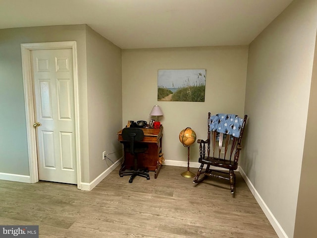 sitting room with light hardwood / wood-style flooring