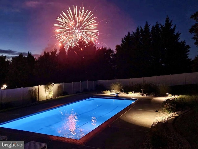 view of pool featuring a diving board