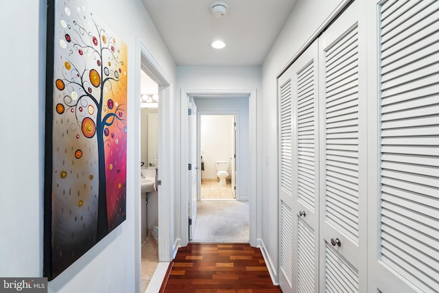 hall with dark wood-type flooring