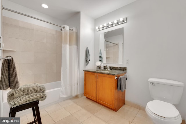 full bathroom with shower / tub combo with curtain, vanity, toilet, and tile patterned flooring