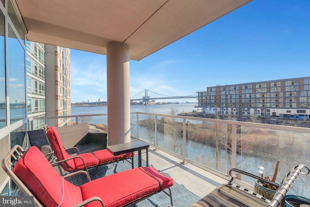 balcony featuring a water view