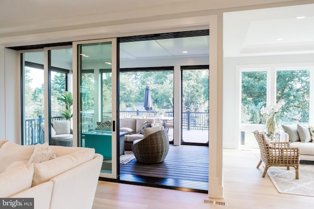 doorway to outside featuring visible vents and wood finished floors