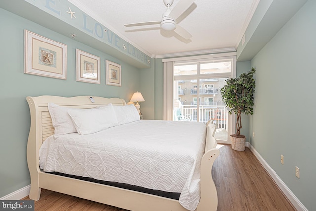 bedroom featuring access to exterior, wood-type flooring, ornamental molding, and ceiling fan