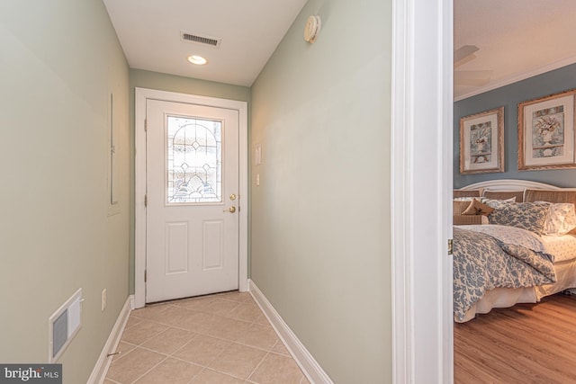 entryway featuring light tile patterned floors