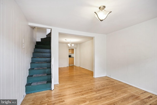 stairs featuring hardwood / wood-style flooring