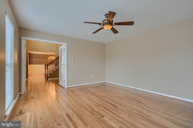 unfurnished room featuring ceiling fan and light hardwood / wood-style flooring