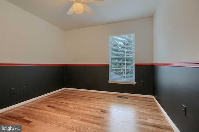 unfurnished room featuring ceiling fan and light hardwood / wood-style flooring