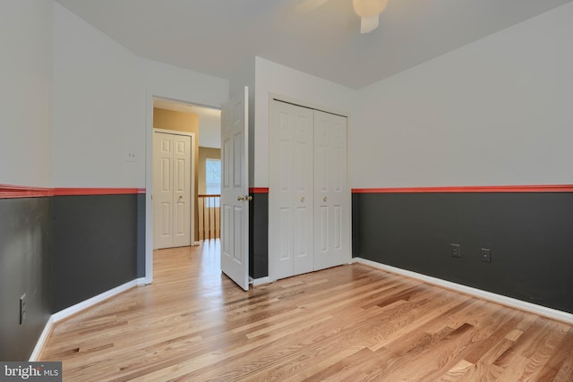 unfurnished room featuring ceiling fan and light hardwood / wood-style flooring