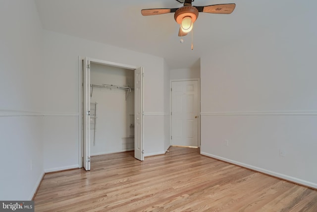 unfurnished bedroom with ceiling fan, a closet, and light hardwood / wood-style flooring