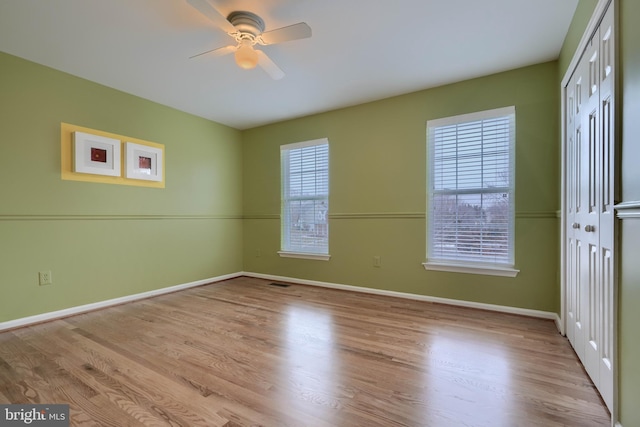 unfurnished room featuring ceiling fan and light hardwood / wood-style flooring