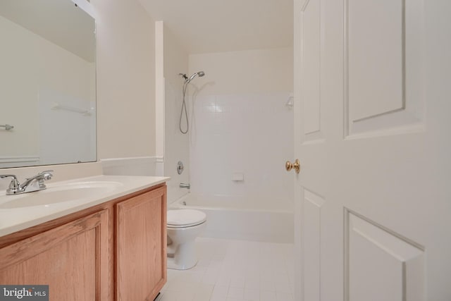 full bathroom with tiled shower / bath, vanity, toilet, and tile patterned floors